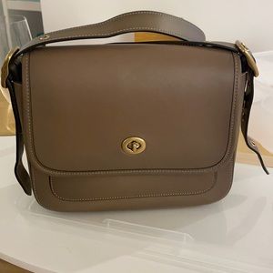 Unused coach taupe saddle bag